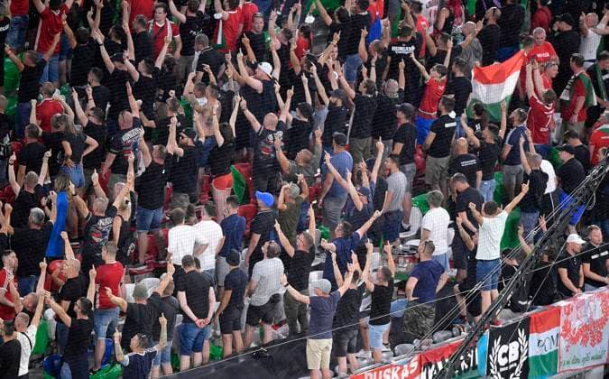 23 06 2021, Football, European Championship 2020, Group F match, Germany Hungary, at the Football Arena Munich disrespectful gesture, Hungarian fans turn away during the German national anthem and show the stinky finger