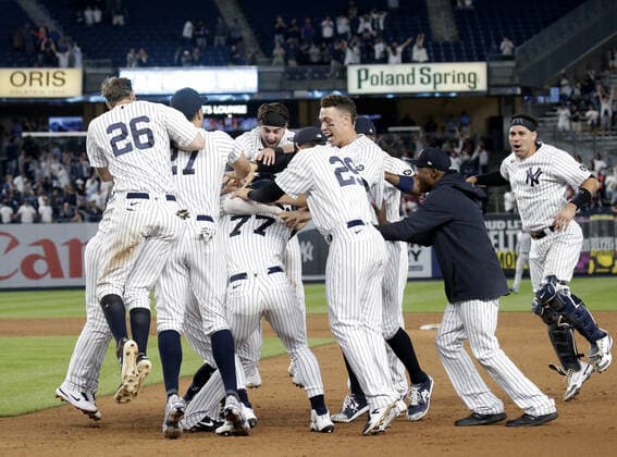 New York Yankees Luke Voit celebrates with teammates after hitting a walk off RBI single in the 9th inning against the Kansas City Royals at Yankee Stadium on Wednesday, June 23, 2021 in New York City. The Yankees defeated the Royals 6-5.  NYP20210623123 JOHNxANGELILLO