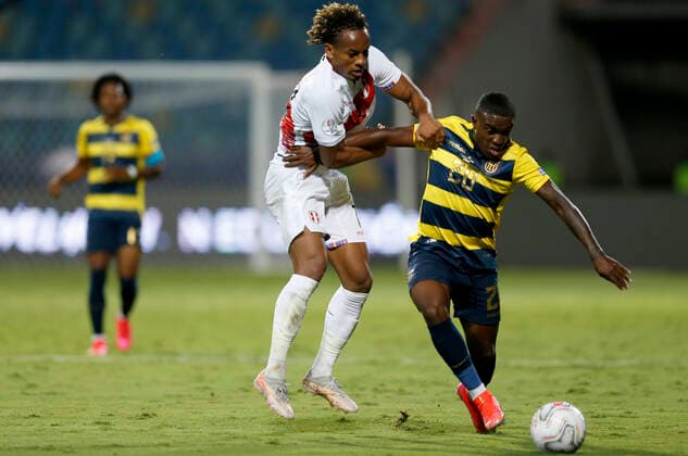 (210624) -- GOIANIA, June 24, 2021 -- Ecuador s Sebastian Mendez (R) vies with Peru s Andre Carrillo during the 2021 Copa America group B football match between Ecuador and Peru in Goiania, Brazil, on June 23, 2021. ) (SP)BRAZIL-GOIANIA-COPA AMERICA-ECUADOR VS PERU LUCIOxTAVORA 