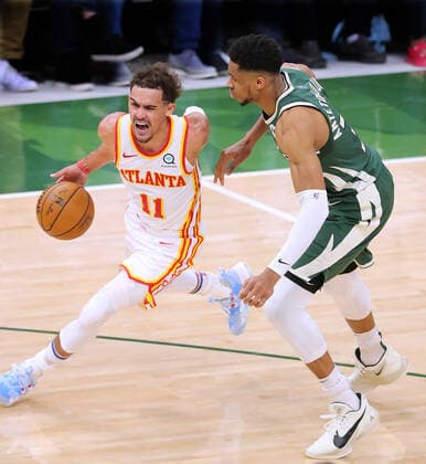 June 23, 2021, Milwaukee, WI, USA: The Atlanta Hawks Trae Young (11) drives past the Milwaukee Bucks Giannis Antetokounmpo on his way to the basket in Game 1 of the NBA, Basketball Herren, USA Eastern Conference Finals on Wednesday, June 23, 2021, at the Fiserv Forum in Milwaukee. The Hawks won, 116-113. Milwaukee USA - ZUMAm67_ 0122638641st Copyright: xCurtisxComptonx