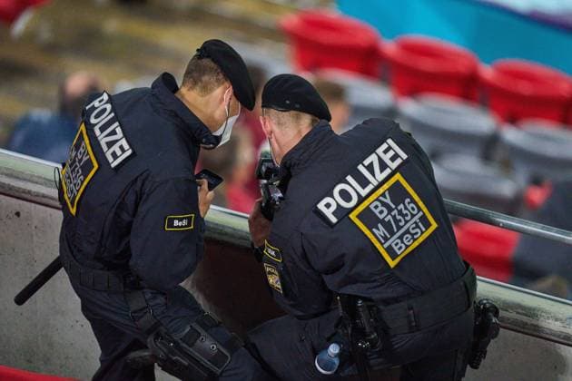 Policemen observe fans in the Group F match GERMANY - HUNGARY 2-2 at the football UEFA European Championships 2020 in Season 2020 2021 on June 23, 2021 in Munich, Germany.