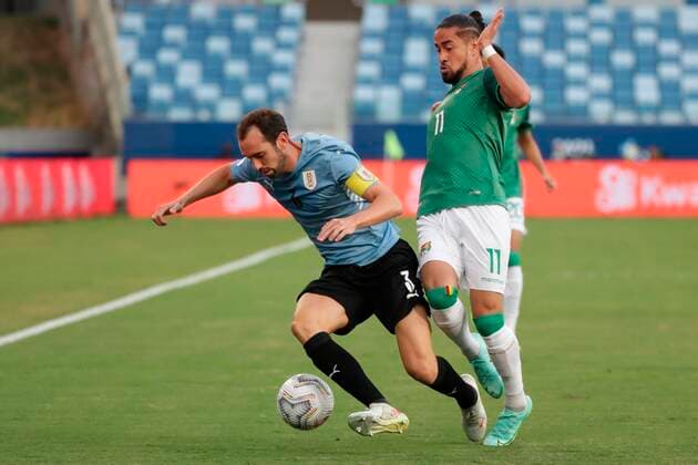 Uruguay s Diego Godin in action against Bolivia s Rodrigo Ramallo, during a match for Group A of the Copa America at the Arena Pantanal stadium in Cuiaba, Brazil, 24 June 2021. Bolivia - Uruguay !ACHTUNG: NUR REDAKTIONELLE NUTZUNG!  Copyright: xRaulxMartinezx AME8258 20210624-5d44bcf45e68ab9ffa8896c66531ac6130d2d82c