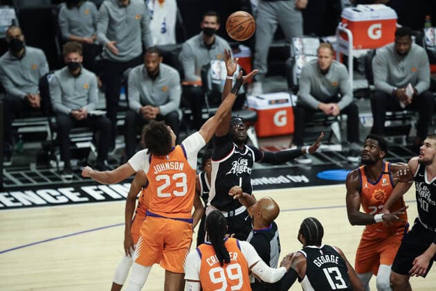 LOS ANGELES, CA - JUNE 24: Phoenix Suns forward Cameron Johnson (23) jumps with LA Clippers guard Reggie Jackson (1) during the Phoenix Suns game versus the Los Angeles Clippers game 3 NBA, Basketball Herren, USA Western Conference Finals game on June 24, 2021, at Staples Center in Los Angeles, CA. (Photo by Jevone Moore Icon Sportswire) NBA: JUN 24 Western Conference Final - Suns at Clippers Icon210624072