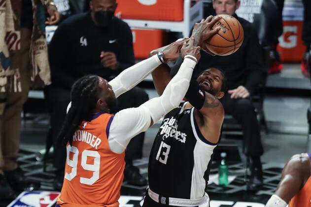 LOS ANGELES, CA - JUNE 24: Phoenix Suns forward Jae Crowder (99) fouls LA Clippers guard Paul George (13) during the Phoenix Suns game versus the Los Angeles Clippers game 3 NBA, Basketball Herren, USA Western Conference Finals game on June 24, 2021, at Staples Center in Los Angeles, CA. (Photo by Jevone Moore Icon Sportswire) NBA: JUN 24 Western Conference Final - Suns at Clippers Icon210624075