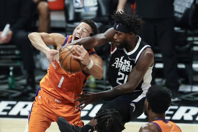 LOS ANGELES, CA - JUNE 24: LA Clippers guard Patrick Beverley (21) blocks Phoenix Suns guard Devin Booker (1) shot during the Phoenix Suns game versus the Los Angeles Clippers game 3 NBA, Basketball Herren, USA Western Conference Finals game on June 24, 2021, at Staples Center in Los Angeles, CA. (Photo by Jevone Moore Icon Sportswire) NBA: JUN 24 Western Conference Final - Suns at Clippers Icon210624048