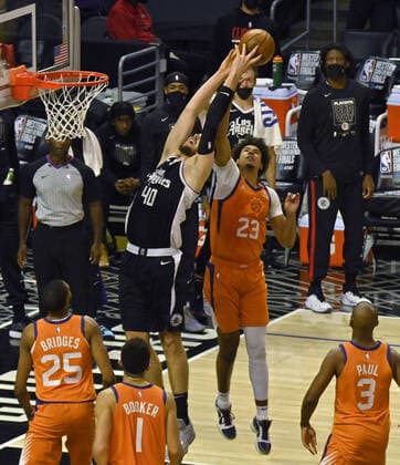 Phoenix Suns forward Cameron Johnson (23) blocks the shot of Los Angeles Clippers center Ivica Zubac during the fourth quarter in Game 3 of their best-of-seven Western Conference finals matchup at Staples Center in Los Angeles on Thursday, June 24, 2021. After dropping the opening two games in Phoenix, the Clippers took Game 3, 106-92 by staying in control throughout.  LAP2021062402 JIMxRUYMEN
