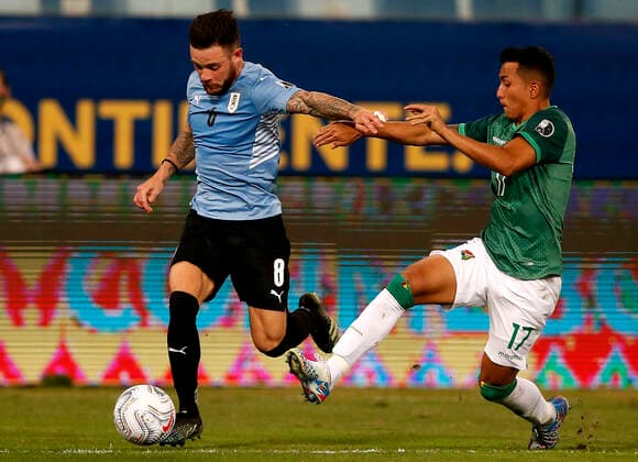 CUIABA, BRAZIL - JUNE 24: Nahitan Nandez of Uruguay competes for the ball with Roberto Carlos Fernandez of Bolivia ,during the match between Bolivia and Uruguay as part of Conmebol Copa America Brazil 2021 at Arena Pantanal on June 24, 2021 in Cuiaba, Brazil. SPO, SOC, ICH 
