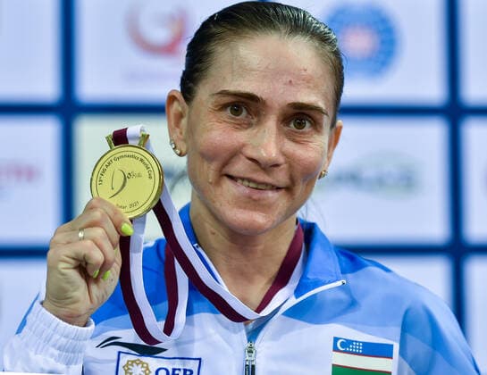 (210626) -- DOHA, June 26, 2021 -- Oksana Chusovitina of Uzbekistan shows her gold medal after the Women s Vault Final at the 13th FIG Artistic Gymnastics World Cup in Doha, capital of Qatar, on June 25, 2021. (Photo by Xinhua) (SP)QATAR-DOHA-GYMNASTICS-WORLD CUP Nikku 