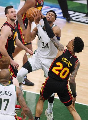 June 25, 2021, Milwaukee, WI, USA: The Atlanta Hawks John Collins (20) fouls the Milwaukee Bucks Giannis Antetokounmpo (34) on his way to the basket during the second quarter in Game 2 of the Eastern Conference Finals on Friday, June 25, 2021, at Fiserv Forum in Milwaukee. Milwaukee USA - ZUMAm67_ 0122918896st Copyright: xCurtisxComptonx