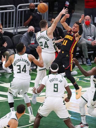 June 25, 2021, Milwaukee, WI, USA: The Atlanta Hawks Trae Young (11) passes off against the Milwaukee Bucks Pat Connaughton (24) and the rest of the Bucks defenders during the first quarter in Game 2 of the Eastern Conference Finals on Friday, June 25, 2021, at Fiserv Forum in Milwaukee. Milwaukee USA - ZUMAm67_ 0122918899st Copyright: xCurtisxComptonx