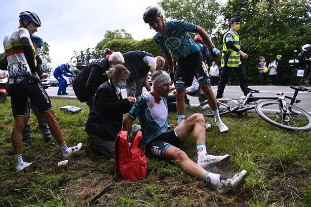 CORRECTION: Cyril Lemoine of Team B&B Hotels receives medical treatment after a fall during the first stage of the 108th edition of the Tour de France cycling race, 197,8km from Brest to Landerneau, France, Saturday 26 June 2021. This year s Tour de France takes place from 26 June to 18 July 2021. POOLxANNE-CHRISTINExPOUJOULAT  x3019210x