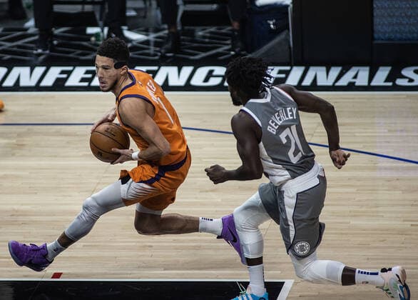 June 26, 2021, Los Angeles, California, USA: Devin Booker 1 of the Phoenix Suns is chased by Patrick Beverley 21 of the Los Angeles Clippers during Game 4 of the 2021 Western Conference finals NBA, Basketball Herren, USA playoff game on Saturday June 26, 2021 at the Staples Center in Los Angeles, California. Clippers lose to Suns 80 - 84. JAVIER ROJASPI Los Angeles USA - ZUMAp124 20210626_zaa_p124_009 Copyright: xx
