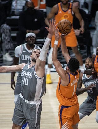June 26, 2021, Los Angeles, California, USA: Devin Booker 1 of the Phoenix Suns puts up a shot over Ivica Zubac 40 of the Los Angeles Clippers during Game 4 of the 2021 Western Conference finals NBA, Basketball Herren, USA playoff game on Saturday June 26, 2021 at the Staples Center in Los Angeles, California. Clippers lose to Suns 80 - 84. JAVIER ROJASPI Los Angeles USA - ZUMAp124 20210626_zaa_p124_010 Copyright: xx