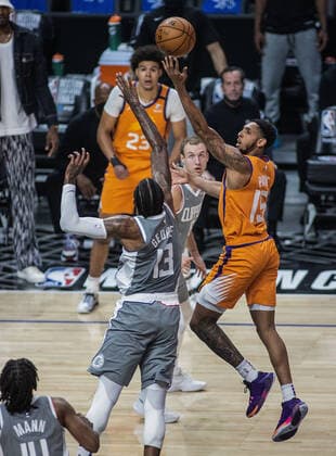 June 26, 2021, Los Angeles, California, USA: Paul George 13 of the Los Angeles Clippers tries to block a shot by Devin Cameron Payne 15 of the Phoenix Suns during Game 4 of the 2021 Western Conference finals NBA, Basketball Herren, USA playoff game on Saturday June 26, 2021 at the Staples Center in Los Angeles, California. Clippers lose to Suns 80 - 84. JAVIER ROJASPI Los Angeles USA - ZUMAp124 20210626_zaa_p124_015 Copyright: xx