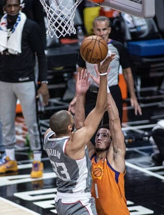 June 26, 2021, Los Angeles, California, USA: Nicolas Batum 33 of the Los Angeles Clippers takes a shot over Devin Booker 1 of the Phoenix Suns during Game 4 of the 2021 Western Conference finals NBA, Basketball Herren, USA playoff game on Saturday June 26, 2021 at the Staples Center in Los Angeles, California. Clippers lose to Suns 80 - 84. Clippers lose to Suns 80 - 84. JAVIER ROJASPI Los Angeles USA - ZUMAp124 20210626_zaa_p124_017 Copyright: xx