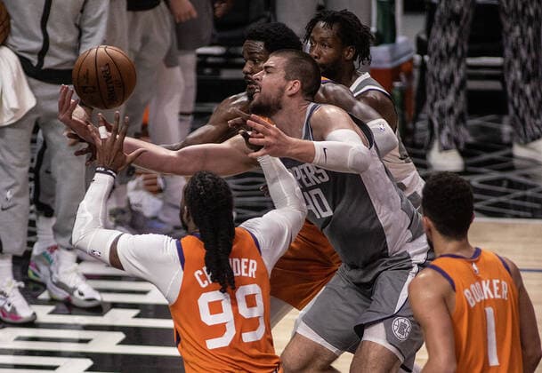 June 26, 2021, Los Angeles, California, USA: Ivica Zubac 40 of the Los Angeles Clippers fights for the rebound with Deandre Ayton 22 and Jae Crowder 99 of the Phoenix Suns during Game 4 of the 2021 Western Conference finals NBA, Basketball Herren, USA playoff game on Saturday June 26, 2021 at the Staples Center in Los Angeles, California. Clippers lose to Suns 80 - 84. JAVIER ROJASPI Los Angeles USA - ZUMAp124 20210626_zaa_p124_038 Copyright: xx