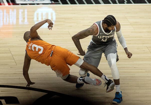June 26, 2021, Los Angeles, California, USA: Paul George 13 of the Los Angeles Clippers fouls Chris Paul 3 of the Phoenix Suns during Game 4 of the 2021 Western Conference finals NBA, Basketball Herren, USA playoff game against the Phoenix Suns on Saturday June 26, 2021 at the Staples Center in Los Angeles, California. Clippers lose to Suns 80 - 84. JAVIER ROJASPI Los Angeles USA - ZUMAp124 20210626_zaa_p124_071 Copyright: xx