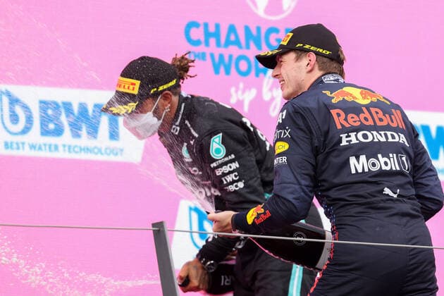 Formula 1 - GP of Styria 2021 SPIELBERG,AUSTRIA,27.JUN.21 - MOTORSPORTS, FORMULA 1 - Grand Prix of Styria, Red Bull Ring. Image shows the rejoicing of Lewis Hamilton (GBR Mercedes) and Max Verstappen (NED Red Bull Racing). Keywords: champaign.  GEPAxpictures xChristianxWalgram
