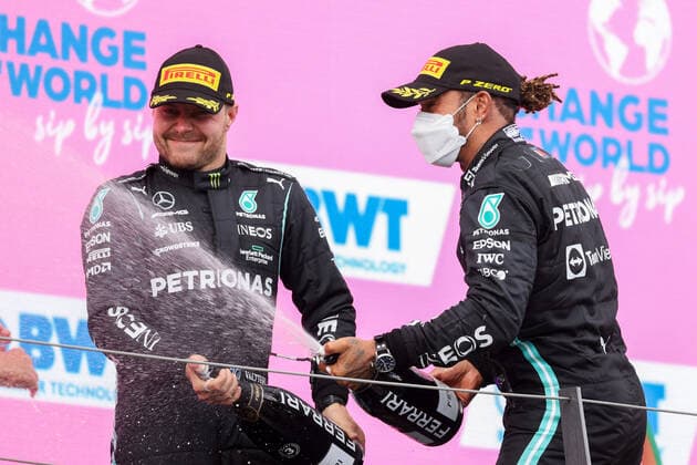 Formula 1 - GP of Styria 2021 SPIELBERG,AUSTRIA,27.JUN.21 - MOTORSPORTS, FORMULA 1 - Grand Prix of Styria, Red Bull Ring. Image shows the rejoicing of Valtteri Bottas (FIN Mercedes) and Lewis Hamilton (GBR Mercedes). Keywords: champaign.  GEPAxpictures xChristianxWalgram
