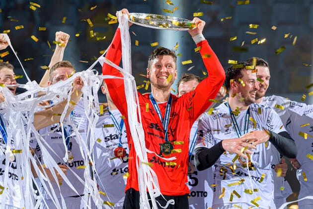 Mannheim, Germany 27 June 2021 HBL 20 21 Rhein Neckar Loewen vs THW Kiel Goalkeeper Niklas Landin THW Kiel with the championship trophy Mannheim SAP Arena Baden Württemberg Germany