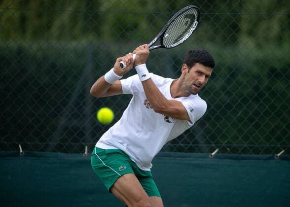 Mandatory Credit: Photo by AELTC Shutterstock (12172322ad) Novak Djokovic (SRB) on the Aorangi Practice Courts ahead of The Championships 2021 Wimbledon Tennis Championships, Preparations, The All England Lawn Tennis and Croquet Club, London, UK - 27 Jun 2021 Editorial Use Only Wimbledon Tennis Championships, Preparations, The All England Lawn Tennis and Croquet Club, London, UK - 27 Jun 2021 Editorial Use Only  Copyright: xAELTC Shutterstockx 12172322ad