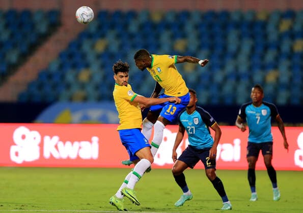 GOIANIA, BRAZIL - JUNE 27: Emerson and Lucas Paqueta of Brazil head the ball against Diego Palacios of Ecuador ,during the match between Brazil and Ecuador as part of Conmebol Copa America Brazil 2021 at Estadio Olimpico on June 27, 2021 in Goiania, Brazil. SPO, SOC 