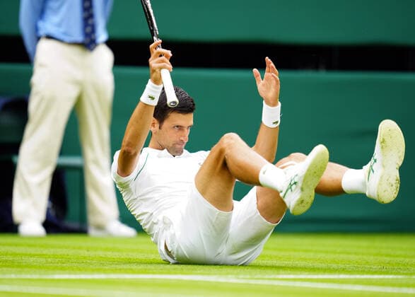 Mandatory Credit: Photo by Javier Garcia BPI Shutterstock (12172248db) Novak Djokovic slips on Centre Court Wimbledon Tennis Championships, Day 1, The All England Lawn Tennis and Croquet Club, London, UK - 28 Jun 2021 Wimbledon Tennis Championships, Day 1, The All England Lawn Tennis and Croquet Club, London, UK - 28 Jun 2021  Copyright: xJavierxGarcia BPI Shutterstockx 12172248db