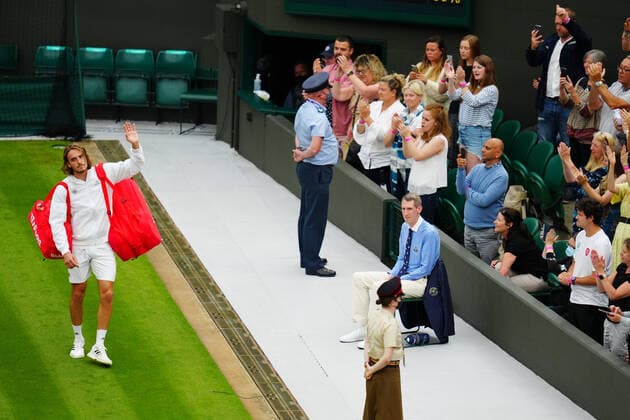 Mandatory Credit: Photo by Javier Garcia BPI Shutterstock (12172248js) Stefanos Tsitsipas waves to the crowd after defeat in his first round match Wimbledon Tennis Championships, Day 1, The All England Lawn Tennis and Croquet Club, London, UK - 28 Jun 2021 Wimbledon Tennis Championships, Day 1, The All England Lawn Tennis and Croquet Club, London, UK - 28 Jun 2021  Copyright: xJavierxGarcia BPI Shutterstockx 12172248js