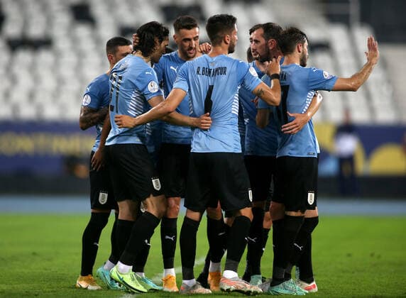 RIO DE JANEIRO, BRAZIL - JUNE 28: Edinson Cavani of Uruguay celebrates with his team mates after scores his penalty goal ,during the match between Uruguay and Paraguay as part of Conmebol Copa America Brazil 2021 at Estadio Olimpico Nilton Santos on June 28, 2021 in Rio de Janeiro, Brazil. SPO, SOC, ICH 