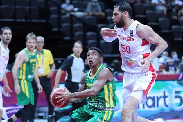 PXL_Tunisia vs Brazil Yago Santos and Salah Mejri during group B basketball qualification match for the Olympic Games, Olympische Spiele, Olympia, OS between Tunisia and Brazil at the Spaladium Arena, in Split, Croatia, on June 29, 2021. IvoxCagalj PIXSELL