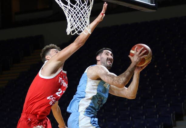 June 29, 2021, Victoria, BC, Canada: Turkey s Alperen Sengun, left, tries to block Uruguay s Mathias Calfani from scoring a basket during first half FIBA Men s Olympic Qualifying basketball action at Memorial Arena in Victoria, Tuesday, June 29, 2021. Alperen Sengun,Mathias Calfani - ZUMAc35_ 20210629_zaf_c35_038 Copyright: xChadxHipolitox