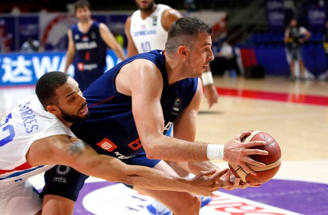 (210630) -- BELGRADE, June 30, 2021 -- Serbia s Nemanja Bjelica (R) vies with Dominican Republic s Michael Torres Cuevas during FIBA Olympic Qualifying Tournament basketball match between Serbia and Dominican Republic in Belgrade, Serbia on June 29, 2021. (Photo by Xinhua) (SP)SERBIA-BELGRADE-BASKETBALL-FIBA OQT-DOMINICAN REPUBLIC VS SERBIA PredragxMilosavljevic 