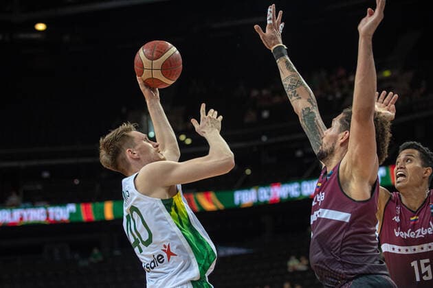 (210630) -- KAUNAS, June 30, 2021 -- Marius Grigonis (L) of Lithuania shoots during FIBA Olympic Qualifyng Tournament basketball match between Lithuania and Venezuela in Kaunas, Lithuania, June 29, 2021. (Photo by Xinhua) (SP)LITHUANIA-KAUNAS-BASKETBALL-FIBA OQT-LITHUANIA VS VENEZUELA AlfredasxPliadis 