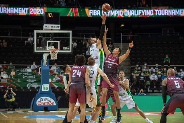 (210630) -- KAUNAS, June 30, 2021 -- Jonas Valanciunas (Top L) of Lithuania vies with Windi Graterol (Top R) of Venezuela during FIBA Olympic Qualifyng Tournament basketball match between Lithuania and Venezuela in Kaunas, Lithuania, June 29, 2021. (Photo by Xinhua) (SP)LITHUANIA-KAUNAS-BASKETBALL-FIBA OQT-LITHUANIA VS VENEZUELA AlfredasxPliadis 