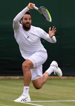 Mandatory Credit: Photo by AELTC Shutterstock (12189895bu) Salvatore Caruso (ITA) in action against Marin Cilic (CRO) on Court 18 in the first round of the Gentlemen s Singles at The Championships 2021 Wimbledon Tennis Championships, Day 2, The All England Lawn Tennis and Croquet Club, London, UK - 29 Jun 2021 Editorial Use Only Wimbledon Tennis Championships, Day 2, The All England Lawn Tennis and Croquet Club, London, UK - 29 Jun 2021 Editorial Use Only  Copyright: xAELTC Shutterstockx 12189895bu