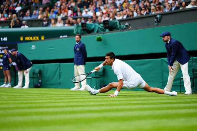 Mandatory Credit: Photo by Javier Garcia BPI Shutterstock (12189891g) Novak Djokovic slips during his second round match Wimbledon Tennis Championships, Day 3, The All England Lawn Tennis and Croquet Club, London, UK - 30 Jun 2021 Wimbledon Tennis Championships, Day 3, The All England Lawn Tennis and Croquet Club, London, UK - 30 Jun 2021  Copyright: xJavierxGarcia BPI Shutterstockx 12189891g