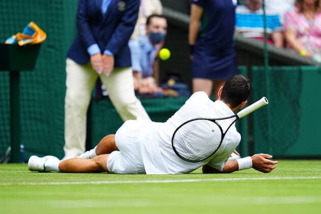 Mandatory Credit: Photo by Javier Garcia BPI Shutterstock (12189891j) Novak Djokovic slips during his second round match Wimbledon Tennis Championships, Day 3, The All England Lawn Tennis and Croquet Club, London, UK - 30 Jun 2021 Wimbledon Tennis Championships, Day 3, The All England Lawn Tennis and Croquet Club, London, UK - 30 Jun 2021  Copyright: xJavierxGarcia BPI Shutterstockx 12189891j