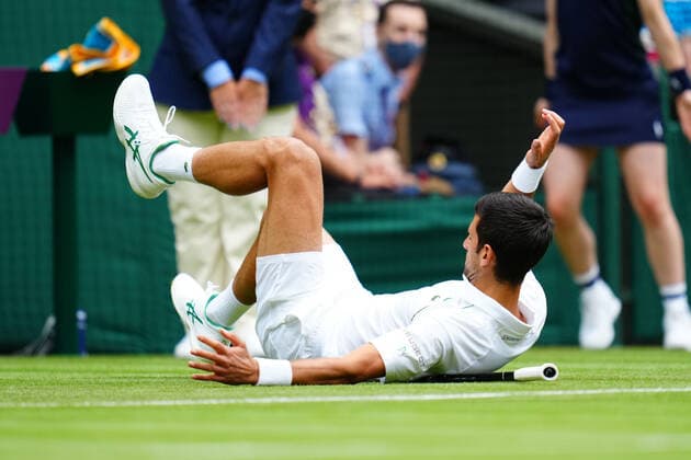 Mandatory Credit: Photo by Javier Garcia BPI Shutterstock (12189891l) Novak Djokovic slips during his second round match Wimbledon Tennis Championships, Day 3, The All England Lawn Tennis and Croquet Club, London, UK - 30 Jun 2021 Wimbledon Tennis Championships, Day 3, The All England Lawn Tennis and Croquet Club, London, UK - 30 Jun 2021  Copyright: xJavierxGarcia BPI Shutterstockx 12189891l