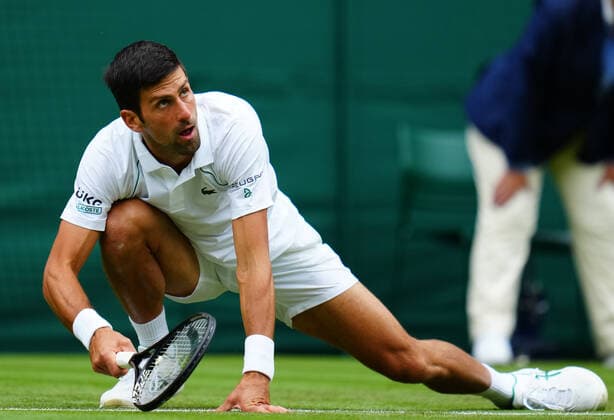 Mandatory Credit: Photo by Javier Garcia BPI Shutterstock (12189891dg) Novak Djokovic slipping during his second round match Wimbledon Tennis Championships, Day 3, The All England Lawn Tennis and Croquet Club, London, UK - 30 Jun 2021 Wimbledon Tennis Championships, Day 3, The All England Lawn Tennis and Croquet Club, London, UK - 30 Jun 2021  Copyright: xJavierxGarcia BPI Shutterstockx 12189891dg