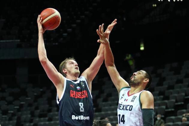 PXL_Mexico v Russia - Group A: 2020 FIBA Men s Olympic Qualifying Tournaments SPLIT, CROATIA - JUNE 30: Vladimir Ivlev of Russia goes to the hoop Gustavo Ayon of Mexico tries to block during the 2020 FIBA Men s Olympic Qualifying Tournament game between Mexico and Russia at Spaladium Arena on June 30, 2021 in Split, Croatia. IvoxCagalj PIXSELL
