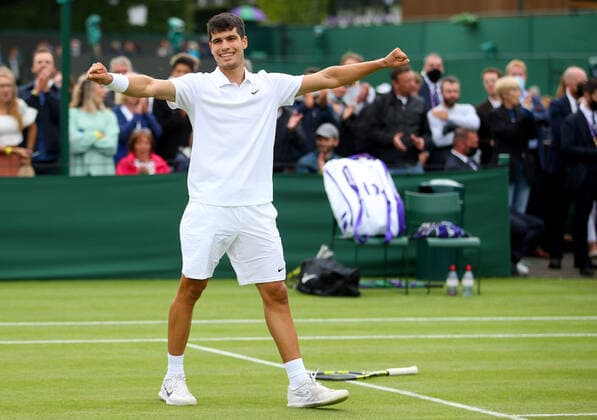 Mandatory Credit: Photo by Shutterstock (12190133ad) Carlos Alcaraz of Spain celebrates on match point Wimbledon Tennis Championships, Day 3, The All England Lawn Tennis and Croquet Club, London, UK - 30 Jun 2021 Wimbledon Tennis Championships, Day 3, The All England Lawn Tennis and Croquet Club, London, UK - 30 Jun 2021  Copyright: xShutterstockx 12190133ad