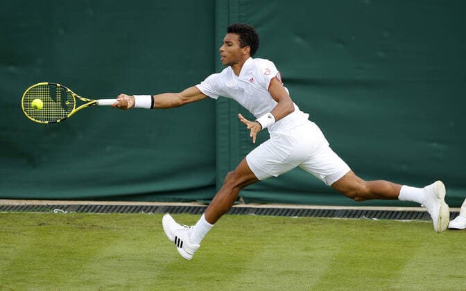Mandatory Credit: Photo by Shutterstock (12190133bq) Felix Auger Aliassime of Canada in action Wimbledon Tennis Championships, Day 3, The All England Lawn Tennis and Croquet Club, London, UK - 30 Jun 2021 Wimbledon Tennis Championships, Day 3, The All England Lawn Tennis and Croquet Club, London, UK - 30 Jun 2021  Copyright: xShutterstockx 12190133bq