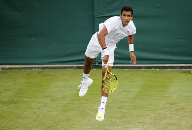 Mandatory Credit: Photo by Shutterstock (12190133bm) Felix Auger Aliassime of Canada in action Wimbledon Tennis Championships, Day 3, The All England Lawn Tennis and Croquet Club, London, UK - 30 Jun 2021 Wimbledon Tennis Championships, Day 3, The All England Lawn Tennis and Croquet Club, London, UK - 30 Jun 2021  Copyright: xShutterstockx 12190133bm