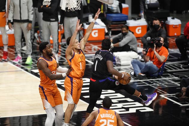 LOS ANGELES, CA - JUNE 30: LA Clippers guard Reggie Jackson (1) guarded by Phoenix Suns guard Devin Booker (1) during game 6 of the NBA, Basketball Herren, USA Western Conference Final between the Phoenix Suns and the Los Angeles Clippers on June 30, 2021, at Staples Center in Los Angeles, CA. (Photo by Jevone Moore Icon Sportswire) NBA: JUN 30 Western Conference Final - Suns at Clippers Icon210630004