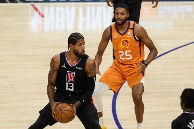 LOS ANGELES, CA - JUNE 30: LA Clippers guard Paul George (13) guarded by Phoenix Suns forward Mikal Bridges (25) during game 6 of the NBA, Basketball Herren, USA Western Conference Final between the Phoenix Suns and the Los Angeles Clippers on June 30, 2021, at Staples Center in Los Angeles, CA. (Photo by Jevone Moore Icon Sportswire) NBA: JUN 30 Western Conference Final - Suns at Clippers Icon210630015