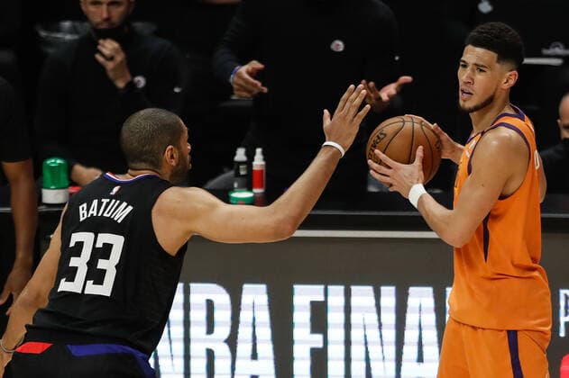 LOS ANGELES, CA - JUNE 30: Phoenix Suns guard Devin Booker (1) guarded by LA Clippers forward Nicolas Batum (33) during game 6 of the NBA, Basketball Herren, USA Western Conference Final between the Phoenix Suns and the Los Angeles Clippers on June 30, 2021, at Staples Center in Los Angeles, CA. (Photo by Jevone Moore Icon Sportswire) NBA: JUN 30 Western Conference Final - Suns at Clippers Icon210630021