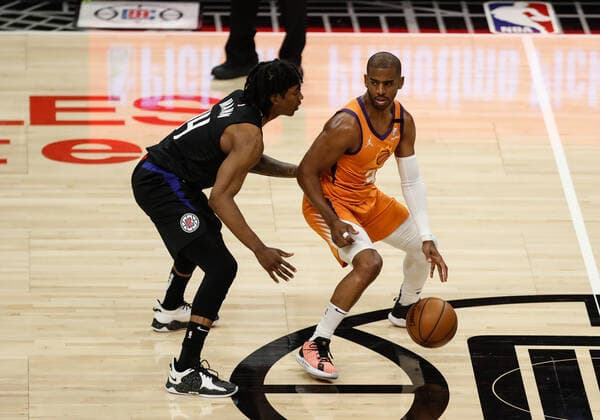 LOS ANGELES, CA - JUNE 30: LA Clippers guard Terance Mann (14) guarding Phoenix Suns guard Chris Paul (3) during game 6 of the NBA, Basketball Herren, USA Western Conference Final between the Phoenix Suns and the Los Angeles Clippers on June 30, 2021, at Staples Center in Los Angeles, CA. (Photo by Jevone Moore Icon Sportswire) NBA: JUN 30 Western Conference Final - Suns at Clippers Icon210630030