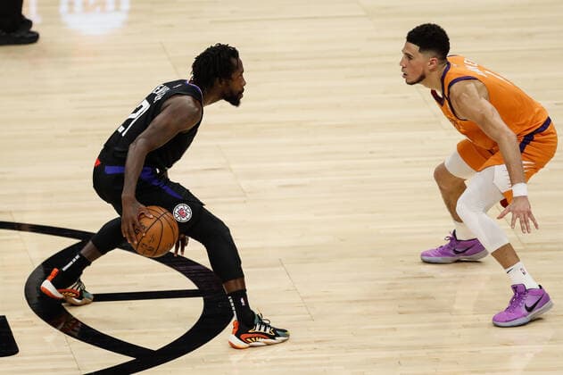 LOS ANGELES, CA - JUNE 30: LA Clippers guard Patrick Beverley (21) guarded by Phoenix Suns guard Devin Booker (1) during game 6 of the NBA, Basketball Herren, USA Western Conference Final between the Phoenix Suns and the Los Angeles Clippers on June 30, 2021, at Staples Center in Los Angeles, CA. (Photo by Jevone Moore Icon Sportswire) NBA: JUN 30 Western Conference Final - Suns at Clippers Icon210630042