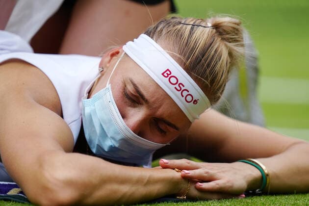 Mandatory Credit: Photo by Shutterstock (12191444ev) Elena Vesnina receiving treatment during her second round match Wimbledon Tennis Championships, Day 4, The All England Lawn Tennis and Croquet Club, London, UK - 01 Jul 2021 Wimbledon Tennis Championships, Day 4, The All England Lawn Tennis and Croquet Club, London, UK - 01 Jul 2021  Copyright: xShutterstockx 12191444ev