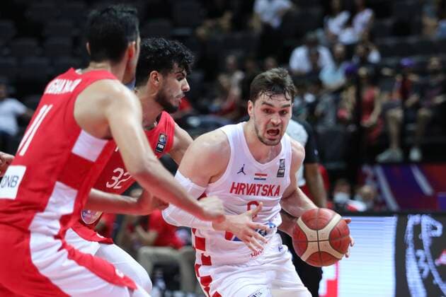 PXL_Croatia v Tunisia - Group A: 2020 FIBA Men s Olympic Qualifying Tournaments SPLIT, CROATIA - JULY 01: Mario Hezonja of Croatia gets pressure from Tunisian players during the 2020 FIBA Men s Olympic Qualifying Tournament game between Croatia and Tunisia at Spaladium Arena on July 1, 2021 in Split, Croatia. IvoxCagalj PIXSELL